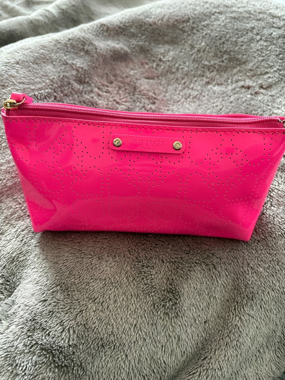 kate spade glossy hot pink cosmetic pouch with perforated logo